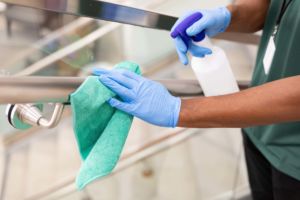 A member of the specialty disinfection crew cleans a retail site as part of the Level 2 disinfection process