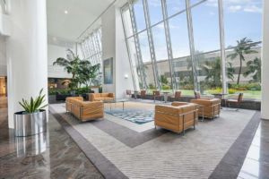 A clean, safe, and healthy commercial facility lobby with clean, large floor to ceiling windows