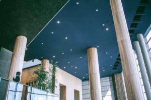 A clean interior of a commercial workplace facility with high ceilings