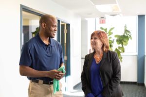 Marsden facility services associate working with client
