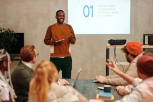 Job seekers and workers in a Workforce Development Program classrooms taking part in a class project to position and prepare them for career advancement and greater self-sufficiency